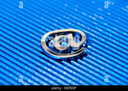 At sign on blue ground Stock Photo