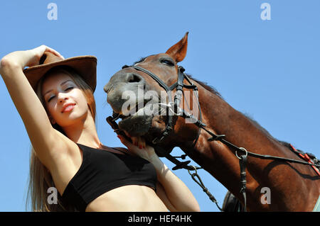 portrait of young attractive woman and her romantic horse Stock Photo