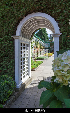 Looking through an arch at Butchart Gardens near Victoria Vancouver Island British Columbia, Canada Stock Photo