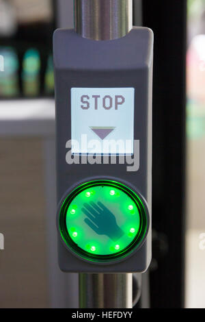 Illuminated city bus stop button Stock Photo