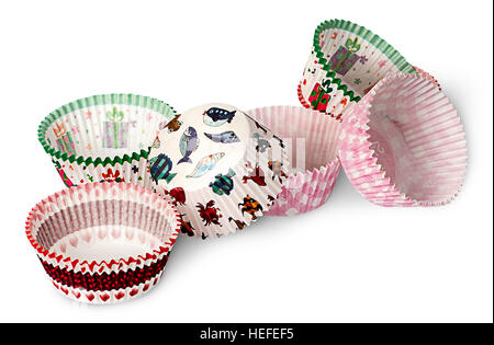 Multicolored paper cups for baking muffins isolated on white background Stock Photo
