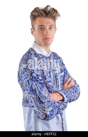 Young blond stylish man dressed in a blue and white patterned shirt with contrasting striped section Stock Photo