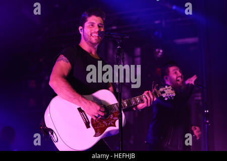 NEW YORK-DEC 16: Dan Smyers (L) and Shay Mooney of Dan + Shay perform in concert at PlayStation Theater on December 16, 2016 in New York City. Stock Photo