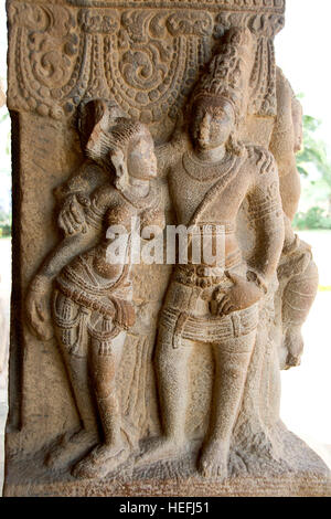 Graceful divine couple carved on stone pillar at Virupaksha Temple in Pattadakal, Bagalkot District, Karnataka, India, Asia Stock Photo