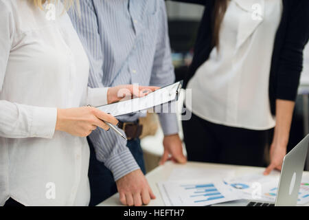 Business people meeting to discuss the situation on the market Stock Photo