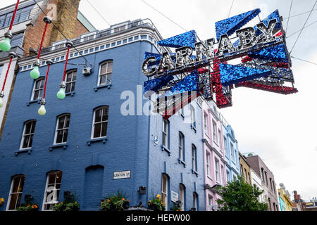 Glittery Union Flag hanging over Carnaby Street in London, UK Stock Photo