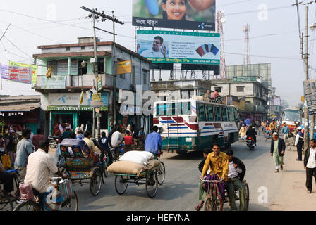 Jessore: Street scene, bus, bicycle rickshaw, Khulna Division, Bangladesh Stock Photo