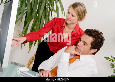 Office workers working on a computer at the office Stock Photo