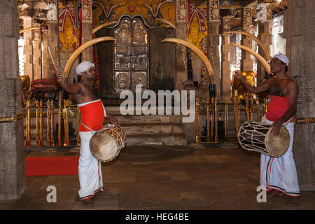 Drummers in front of holy shrine in Sri Dalada Maligawa or Temple of the Sacred Tooth Relic, Buddhist sanctuary, Kandy Stock Photo