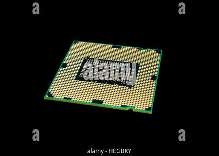 Electronic collection - Computer processor from the bottom side isolated on black background Stock Photo