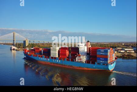 A container ship and stacked containers from cargo shipping line Turkon on the Savannah River in Georgia Stock Photo