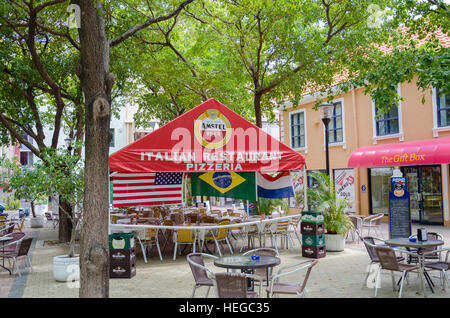 Curacao, Caribbean - October 2, 2012: Squares and Alley ways in Willemstad in Curacao. Handelskade with colorful building facades Stock Photo