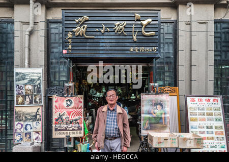 Shanghai, China - April 7, 2013: man in front of Souvenirs handcratf shop store Duolun Road Hongkou District at the city of Shanghai in China on april 7th, 2013 Stock Photo