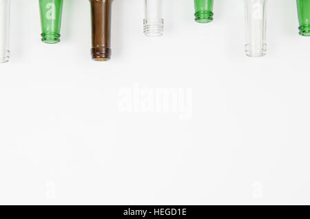 Empty glass bottles of mixed colors including white, green and amber Stock Photo