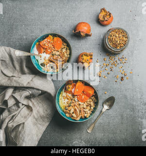 Healthy vegetarian breakfast over grey concrete background, square crop Stock Photo