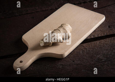 One piece of ginger root on the cutting board Stock Photo