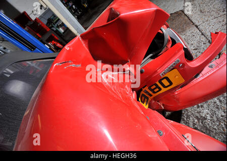 Car wreck. Crash damaged Mk1 Mazda MX5 with the rear bumper folded double after hitting a post backwards (no one was injured) Stock Photo