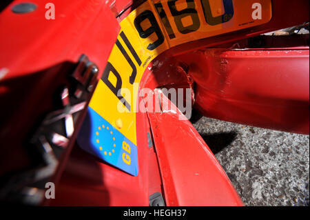 Car wreck. Crash damaged Mk1 Mazda MX5 with the rear bumper folded double after hitting a post backwards (no one was injured) Stock Photo