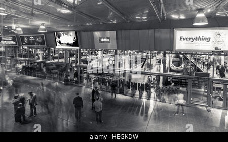 train station, railway, station, travel, busy, rush hour,ghosts,ghosted,rushing,ticket barrier,concourse,platform,Piccadilly Stock Photo