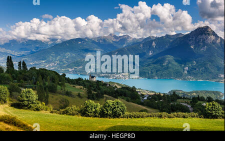 The village of Saint Apollinaire's church with Summer view on Savines-le-Lac, Serre Poncon Lake and Grand Morgon, Alps, France Stock Photo