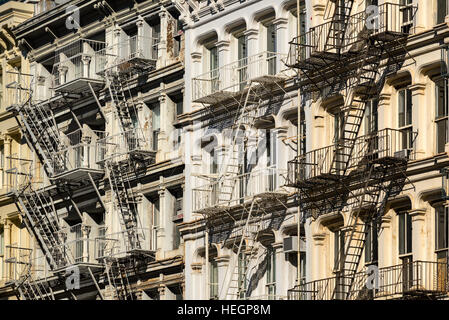 Soho building facades with fire escapes. Greene Street, Manhattan, New York City Stock Photo