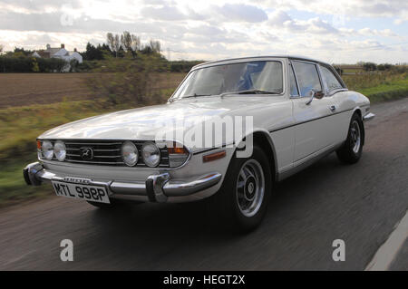 White Triumph Stag hardtop tracking action shot Stock Photo