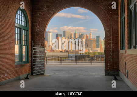 The skyline of lower Manhattan in New York City as viewed through an arched entranceway in Liberty State Park in Jersey City, New Jersey. Stock Photo