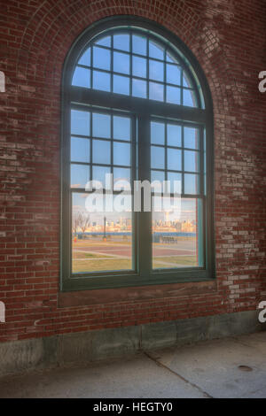 The skyline of New York City as viewed through a window in Liberty State Park in Jersey City, New Jersey. Stock Photo
