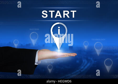 start button with business hand on blurred background Stock Photo