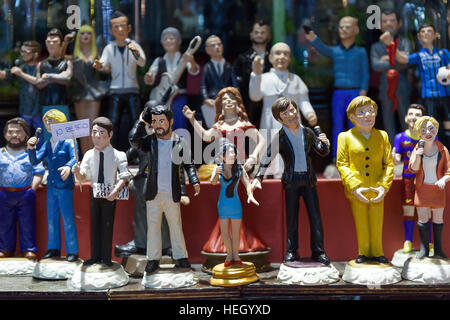 Naples, Italy - December 9, 2016: San Gregorio Armeno, painted statuettes handmade representatives famous celebrities, sports, politics, music and rel Stock Photo