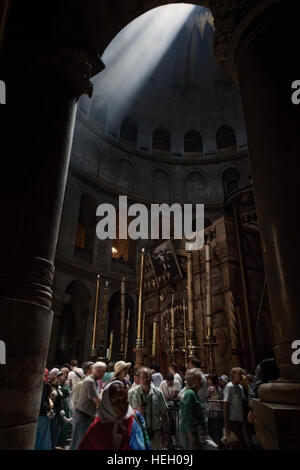 Jerusalem, Israel - May 30, 2014: Pilgrims crowd in front of the entrance to Edicula in the Church of Holy Sepulchre