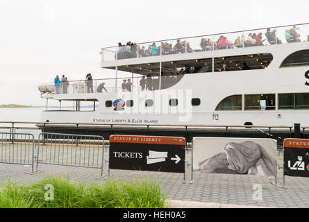 NEW YORK - APRIL 27, 2016: Statue Cruises ferry boat at Battary park in lower Manhattan. the company provides ticketing service and transportation for Stock Photo