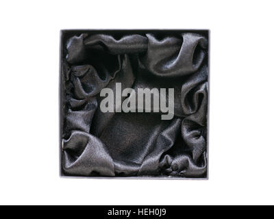 Black gift jewel box with black silk inside. Top view isolated on white Stock Photo