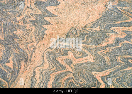 Patterned beige granite with blue veins. Natural stone texture Stock Photo