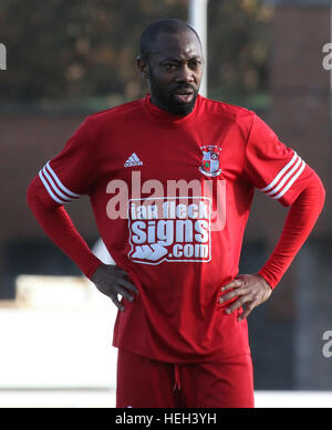 Former Nigerian International Kevin Amuneke (red) playing for Northern Ireland junior side Ballynure Old Boys in the Intermediate Cup against Lisburn Distillery in November 2016. On the 22nd December 2016 local media announced that Amuneke would be joining Irish Premier League side Linfield in the January 2017 transfer window. Stock Photo