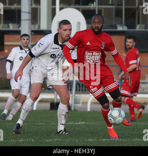 Former Nigerian International Kevin Amuneke (red) playing for Northern Ireland junior side Ballynure Old Boys in the Intermediate Cup against Lisburn Distillery in November 2016. On the 22nd December 2016 local media announced that Amuneke would be joining Irish Premier League side Linfield in the January 2017 transfer window. Stock Photo