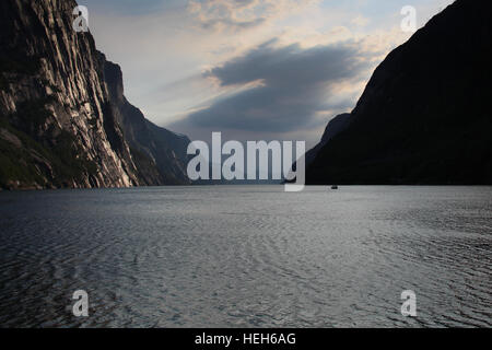 Sunset over a Norwegian fjord with beautiful cloudy skies Stock Photo