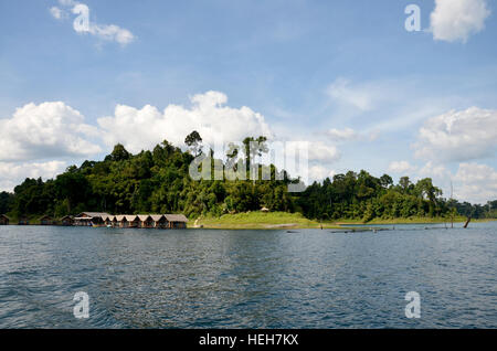 Hut and house in raft resort for People resting in holiday at Cheow Lan Lake at Ratchaprapa or Rajjaprabha Dam Reservoir in Khao Sok National Park in  Stock Photo