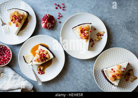 Chocolate Crusted Chèvre Cheesecake with Earl Grey Poached Pears & Pomegranate (gluten-free) Stock Photo