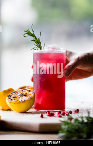 Pomegranate and rosemary cocktail Stock Photo