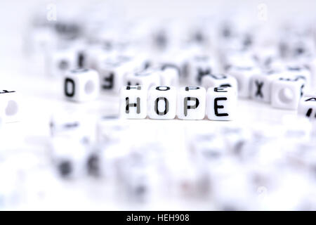 Hope word made from plastic alphabet blocks, stands in white background. Stock Photo