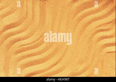 Pattern on the yellow sand, yellow wavy lines Stock Photo