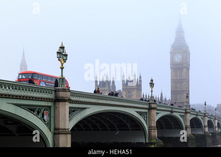 Red London bus passes over Westminster Bridge. In London, England. On 17th December 2016. Stock Photo
