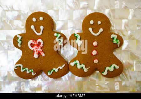 Two gingerbread men cookies decorated for Christmas Stock Photo