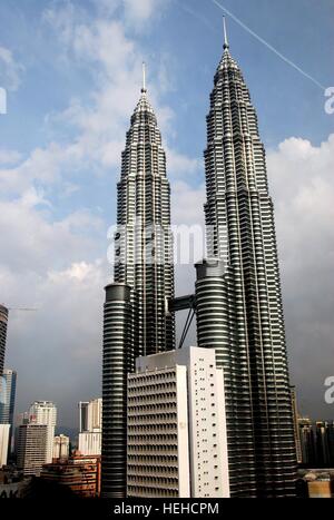 Kuala Lumpur, Malaysia - December 25, 2006:  The twin Petronas Towers at KLCC soar to a height of 451.9 metres over the city Stock Photo