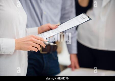 Business people meeting to discuss the situation on the market Stock Photo
