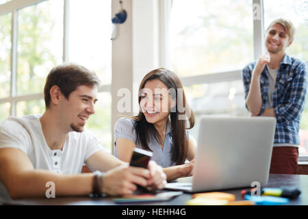 Successful employees discussing design project at meeting Stock Photo