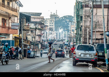 Street view of Siaka Steven road and the historical cotton tree in Freetown, Sierra Leone Stock Photo