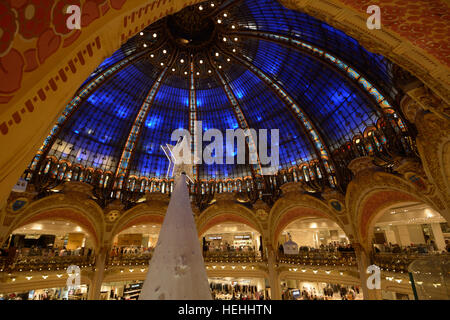 France, Paris, Galeries Lafayette on Boulevard Haussmann, interior with Christmas decoration and white tree, panoramic view Stock Photo