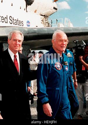 NASA Administrator Dan Goldin (left) walks with astronaut and U.S. Senator John Glenn after his return to Earth following the STS-95 space shuttle Discovery mission at the Kennedy Space Center November 7, 1998 in Merritt Island, Florida.